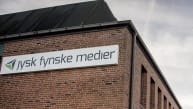 Lønnedgang freder ansatte i Jysk Fynske Medier fra fyringer i tre måneder